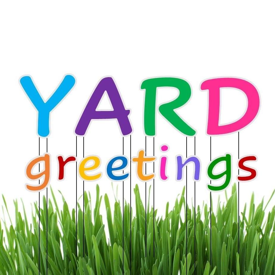 Colorful large lawn letters spelling HAPPY BIRTHDAY arranged on green grass in a suburban yard with balloons